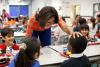 First Lady Michelle Obama has lunch with students at Parklawn Elementary School in Alexandria, Virginia, January 25, 2012. The First Lady and Agriculture Secretary Tom Vilsack visited the school to sample a healthy meal that meets the United States Depart